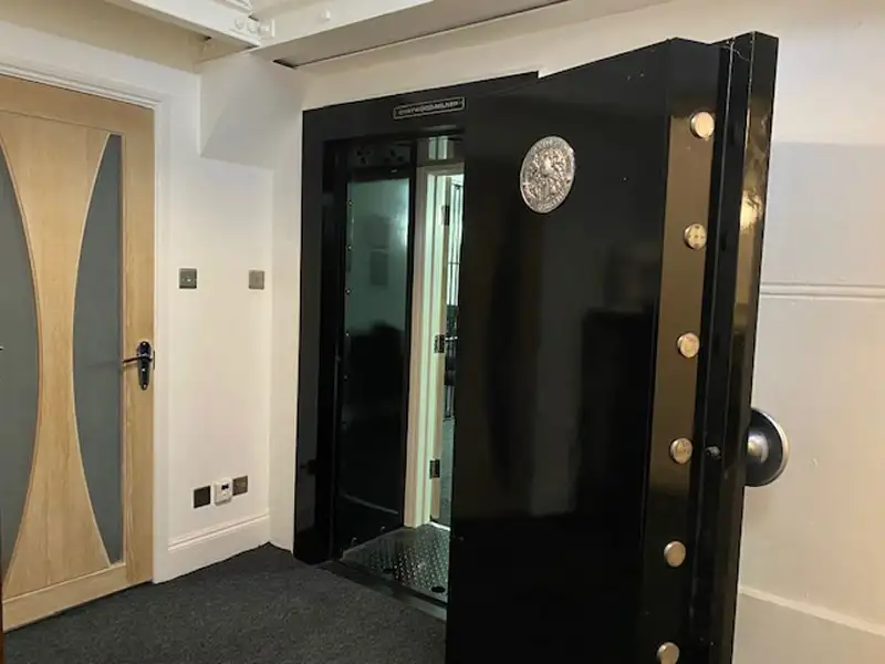 A large walk-in home safe with the door open.