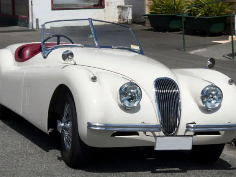 Fully restored white 1951 Jaguar XK120 OTS.