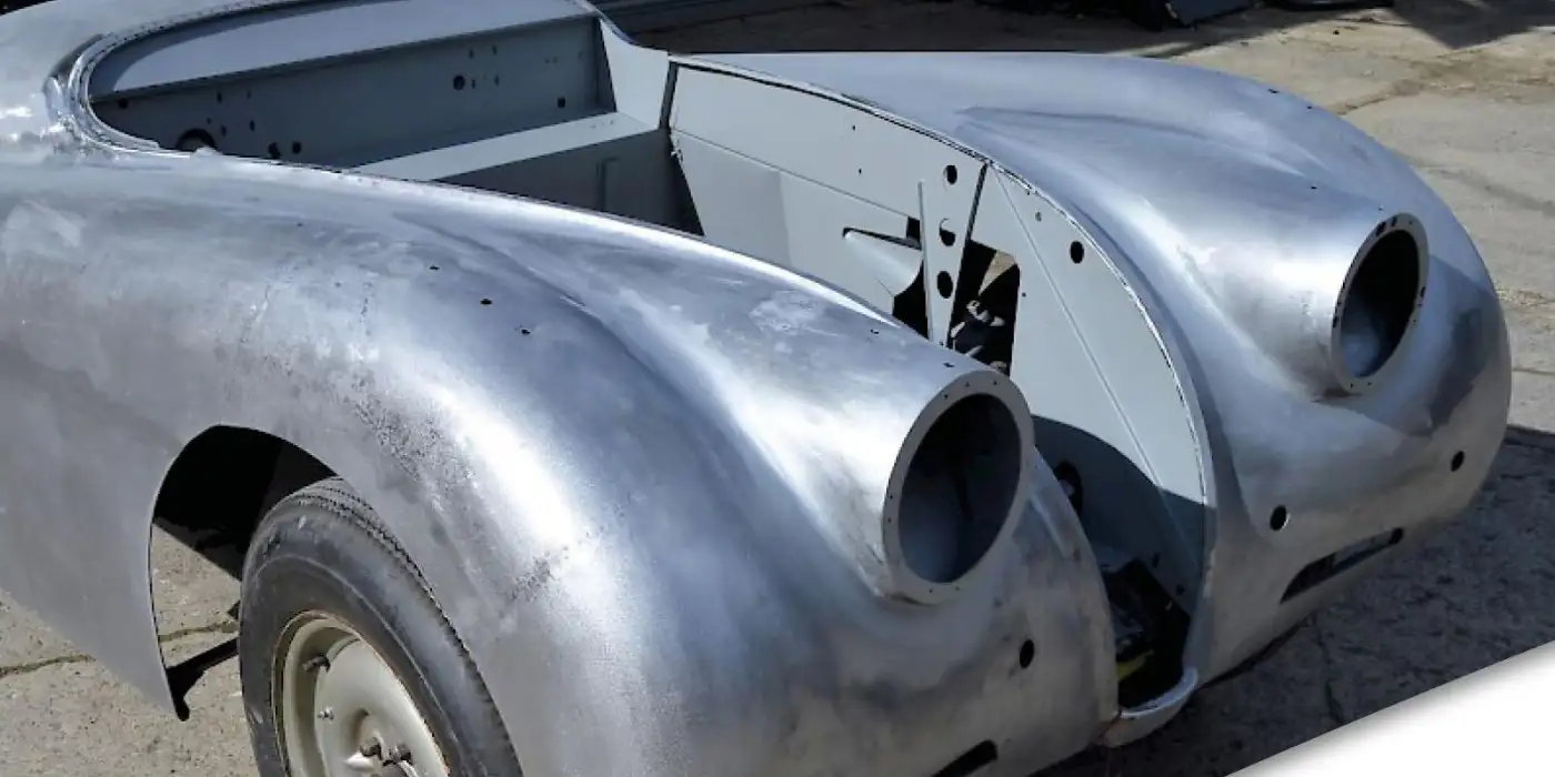 A shell of a Jaguar XK120.